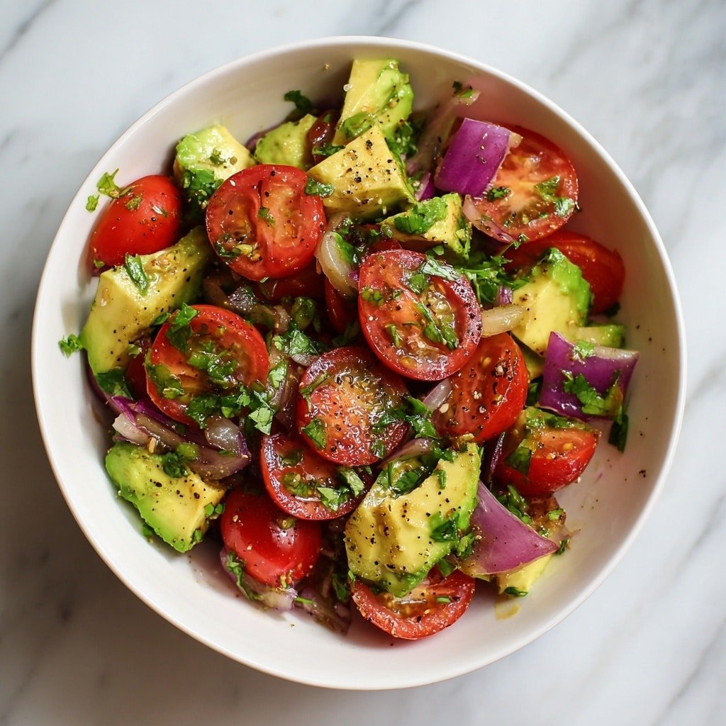Avocado and Tomato Salad with Lime Dressing Recipe - Recipe Image — Avocado and Tomato Salad with Lime Dressing, Fresh avocado tomato salad, Easy healthy salad recipe, Citrus lime vinaigrette salad, Quick summer vegetable salad